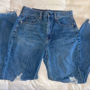 High Rise Ripped Mom Jeans.